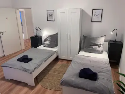 Ein Bett oder Betten in einem Zimmer der Unterkunft bookandstay24 Die-burg 4 Zimmerwohnung mit Küche und Balkon bei Darmstadt, Frankfurt, RheinMain Gebiet