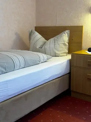 Ein Bett oder Betten in einem Zimmer der Unterkunft Landgasthof Waldschlösschen
