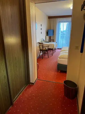 Ein Bett oder Betten in einem Zimmer der Unterkunft Landgasthof Waldschlösschen