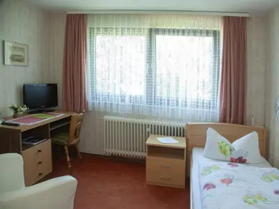 Ein Bett oder Betten in einem Zimmer der Unterkunft Landgasthof Waldschlösschen
