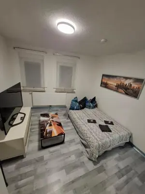Ein Bett oder Betten in einem Zimmer der Unterkunft GRooms