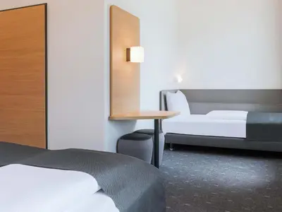 Ein Bett oder Betten in einem Zimmer der Unterkunft B&B HOTEL Bruchsal-Karlsdorf