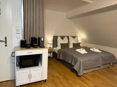 Ein Bett oder Betten in einem Zimmer der Unterkunft BELLA - Business&Family Ap 16, 100m vom Konzerteingang Schloß, Parkplatz, SmartTV, Netflix, Waschmaschine, 24h Checkin, 46qm