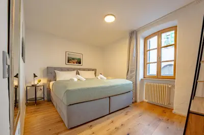Ein Bett oder Betten in einem Zimmer der Unterkunft SCHLOSSBERG RESIDENCES - Design-Apartments im Herzen der Pfalz