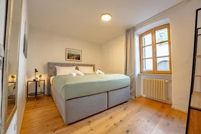 Ein Bett oder Betten in einem Zimmer der Unterkunft SCHLOSSBERG RESIDENCES - Design-Apartments im Herzen der Pfalz