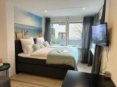 Ein Bett oder Betten in einem Zimmer der Unterkunft Miracle House 160qm Terrasse, Parkplatz & Internet 100mBit -SELF CHECK IN-