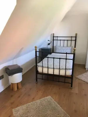 Ein Bett oder Betten in einem Zimmer der Unterkunft Ferienhaus an der KIostermauer