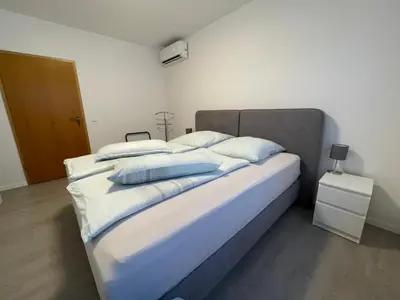 Ein Bett oder Betten in einem Zimmer der Unterkunft Klimatisierte Wohnung