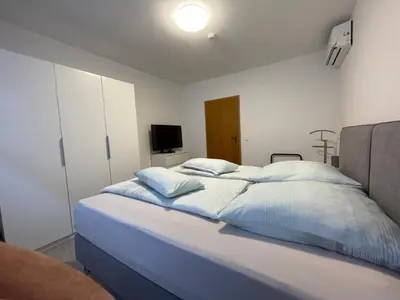 Ein Bett oder Betten in einem Zimmer der Unterkunft Klimatisierte Wohnung
