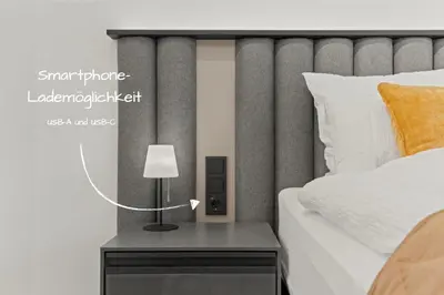 Ein Bett oder Betten in einem Zimmer der Unterkunft 1-2 Personen - Parkplatz - Fahrradgarage - Zentrum - Küche - Balkon - Klima