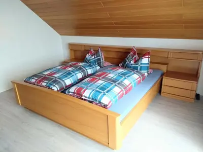 Ein Bett oder Betten in einem Zimmer der Unterkunft Ferien im Winzerhaus