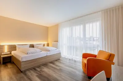 Ein Bett oder Betten in einem Zimmer der Unterkunft Hotel Goll Pforzheim-Niefern
