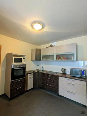 Küche/Küchenzeile in der Unterkunft City Rooms Rastatt