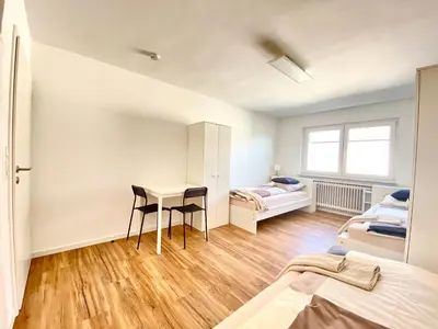 Ein Bett oder Betten in einem Zimmer der Unterkunft City Rooms Tamm