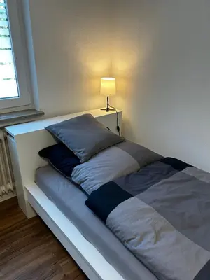 Ein Bett oder Betten in einem Zimmer der Unterkunft City Rooms Tamm