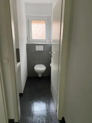 Ein Badezimmer in der Unterkunft City Rooms Tamm