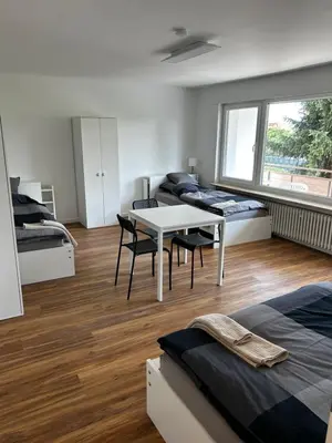 Ein Bett oder Betten in einem Zimmer der Unterkunft City Rooms Tamm
