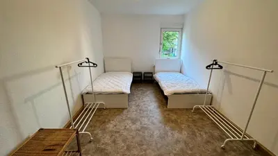 Ein Bett oder Betten in einem Zimmer der Unterkunft Hammer & Rest WHG2