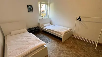 Ein Bett oder Betten in einem Zimmer der Unterkunft Hammer & Rest WHG2