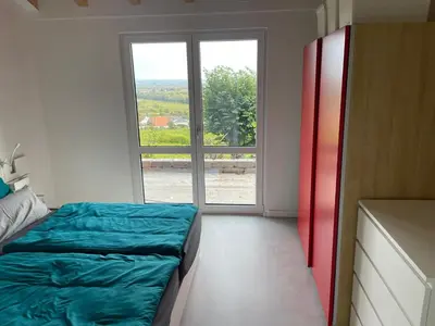 Ein Bett oder Betten in einem Zimmer der Unterkunft Ferienhaus Lindenallee 20