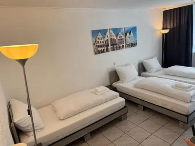 Ein Bett oder Betten in einem Zimmer der Unterkunft Hotel Main Taunus