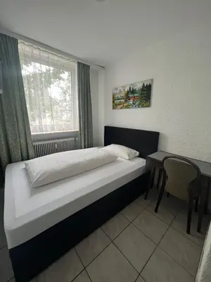 Ein Bett oder Betten in einem Zimmer der Unterkunft Hotel Main Taunus