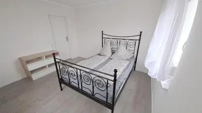 Ein Bett oder Betten in einem Zimmer der Unterkunft Ferienwohnung I&K