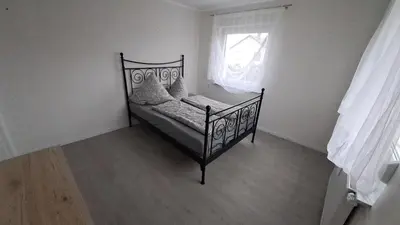 Ein Bett oder Betten in einem Zimmer der Unterkunft Ferienwohnung I&K