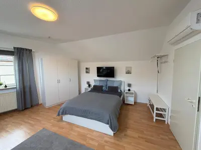 Ein Bett oder Betten in einem Zimmer der Unterkunft Gemütliche 1-Zimmer-Wohnung in Pfungstadt-Eschollbrücken