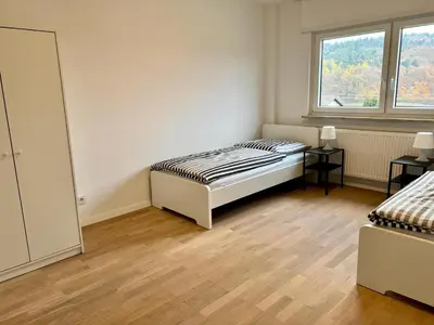 Ein Bett oder Betten in einem Zimmer der Unterkunft Monteur- und Ferienwohnung Hemsbach