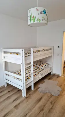 Ein Bett oder Betten in einem Zimmer der Unterkunft Ferienwohnung bei Tripsdrill - ideal für Familien