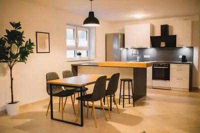 Küche/Küchenzeile in der Unterkunft HUGOS Design House am Waldrand - ruhig & modern