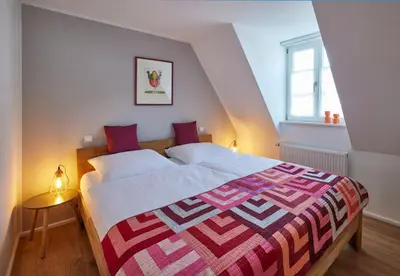 Ein Bett oder Betten in einem Zimmer der Unterkunft Winzerlodge, Wohnung Merlot