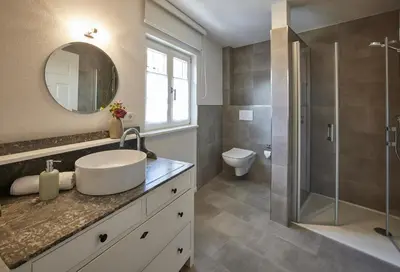 Ein Badezimmer in der Unterkunft Winzerlodge, Wohnung Merlot