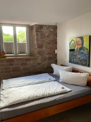 Ein Bett oder Betten in einem Zimmer der Unterkunft Denkmal - Alte Schleiferei