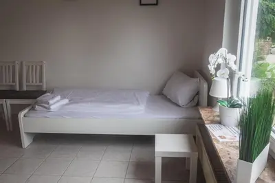 Ein Bett oder Betten in einem Zimmer der Unterkunft Pension Nickel Ferienwohnung EG Am Holzlachgraben