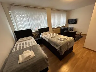 Ein Bett oder Betten in einem Zimmer der Unterkunft Gemütliche 1-Zimmerwohnung in der Stadtmitte