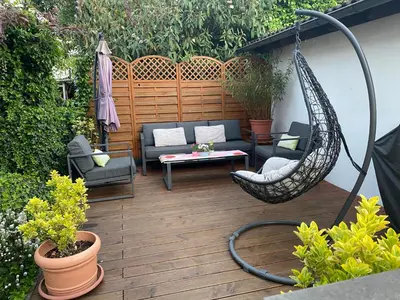 Ein Garten an der Unterkunft Gemütliches Apartment ebenerdig