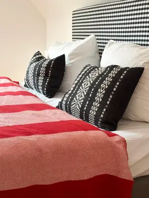 Ein Bett oder Betten in einem Zimmer der Unterkunft Zita Ferienhäuser - Ferienhaus Burgi