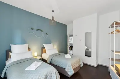 Ein Bett oder Betten in einem Zimmer der Unterkunft Zentral gelegenes 2BR Cityapartment in Neustadt an der Weinstraße