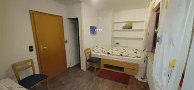 Ein Bett oder Betten in einem Zimmer der Unterkunft Ferienwohnungen Am Sportplatz im Gorxheimertal