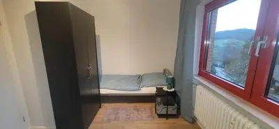 Ein Bett oder Betten in einem Zimmer der Unterkunft Ferienwohnungen Am Sportplatz im Gorxheimertal