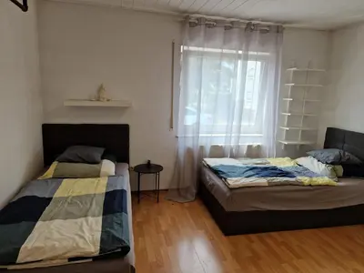 Ein Bett oder Betten in einem Zimmer der Unterkunft WAT Wohnung GR