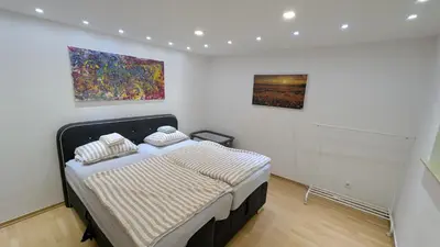 Ein Bett oder Betten in einem Zimmer der Unterkunft FeWo-Seeheim Barrierefrei EG
