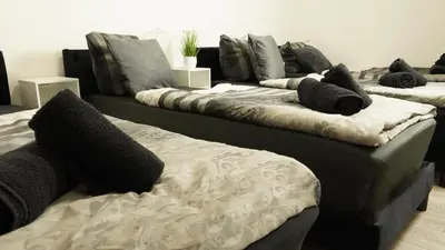 Ein Bett oder Betten in einem Zimmer der Unterkunft Ferienwohnung - modernes Heim Li-Apartments
