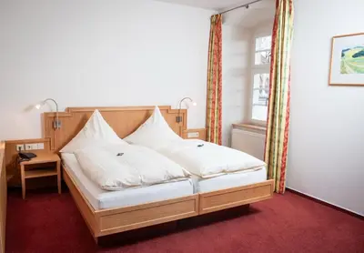 Ein Bett oder Betten in einem Zimmer der Unterkunft Schlosshotel Ravenstein