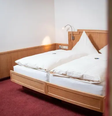 Ein Bett oder Betten in einem Zimmer der Unterkunft Schlosshotel Ravenstein