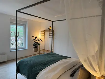 Ein Bett oder Betten in einem Zimmer der Unterkunft Aussichtsterrasse Sankt Martin