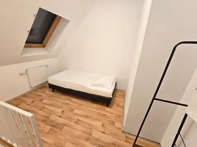 Ein Bett oder Betten in einem Zimmer der Unterkunft Apartments EFDE Boardinghouse Heilbronn