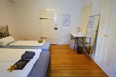 Ein Bett oder Betten in einem Zimmer der Unterkunft Quadrate Hostel Mannheim Z6 Denkmalschutz